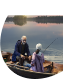 Grandfather in a boat fishing with his grandchild, banner